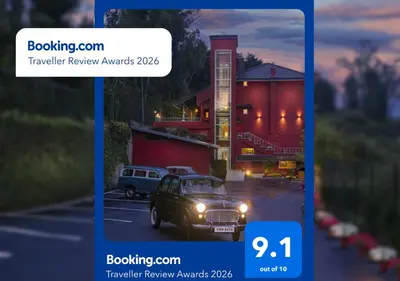 a picture of a car parked in a parking lot at Willow Hill by Nature Resorts and Stays in Ooty