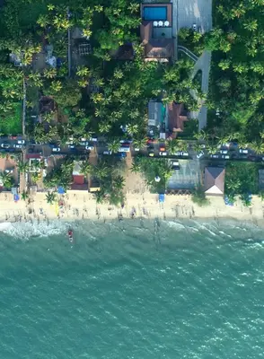 an aerial view of a beach with a group of people at Maliekal Heritance Cherai Beach Cochin in Cherai Beach