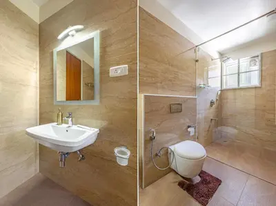 a bathroom with a sink and a toilet at Kalpavriksha 4BR Luxury Villa - Xplore Indo in Kotagiri