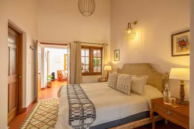 a bedroom with a large bed in a room at amã Stays & Trails - Aberdeen, Coonoor in Wellington Town