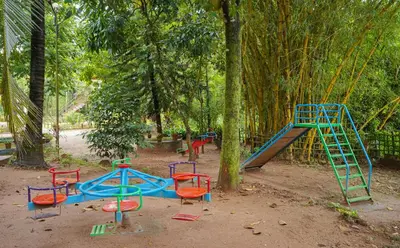 a playground with a slide and a play set at Misty Heights by The Sanihara in Vayittiri