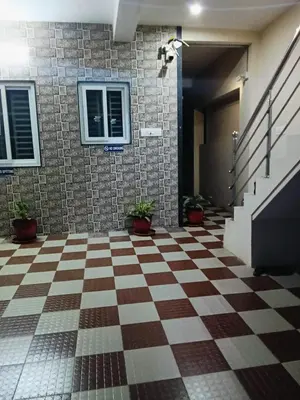 a checkered floor in front of a building at KUKAL CASTLE in Tiruppūr