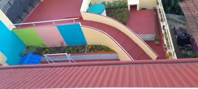 a slide on the roof of a house at Shanthi Villa in Coonoor