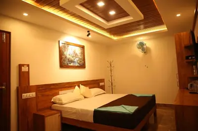 a bedroom with a bed in a room at Bhuvanam homestay in Kalpetta