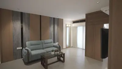 a living room with a couch and a table at RITZ AVENUE LUXURY HOTEL in Mahe