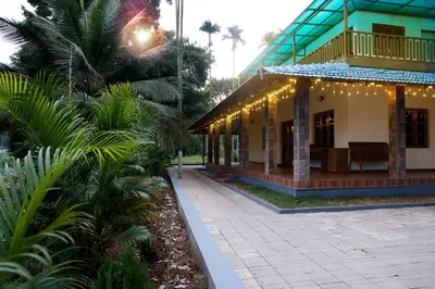 a building with christmas lights on the side of it at PADAVAYAL GREENS in Attappādi