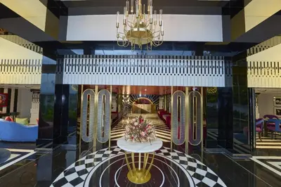 a view of a lobby with a chandelier at Noah Sky Suites in Cochin
