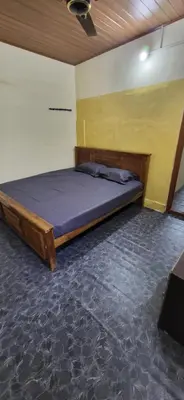 a bedroom with a bed in a room at SPM Residency, From Live2Travel Group. in Masinagudi