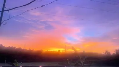 a sunset with the sky in the background at Sukrutham Farmstay in Trichūr