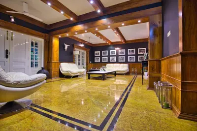 a large room with blue walls and a lobby at Softouch Ayurveda Village Kerala in Kizhake Chālakudi