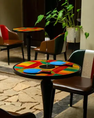 a colorful table sitting on a table in a room at Willow Resorts Wayanad in Ambalavayal