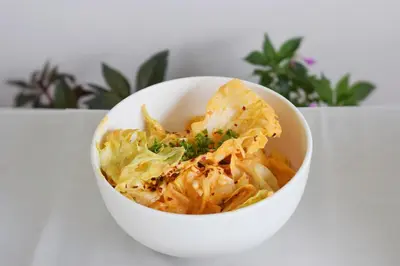 a white bowl of food with noodles and vegetables at Ibex Resorts, Coonoor Leewood in Coonoor