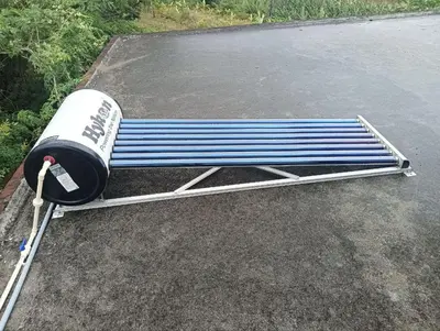 a blue and white bench sitting in a parking lot at BHASURI SERVICED VILLA in Varagampadi