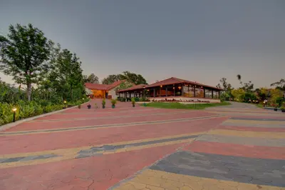 a large plaza with a building in the background at Woodstock Resorts in Madikeri