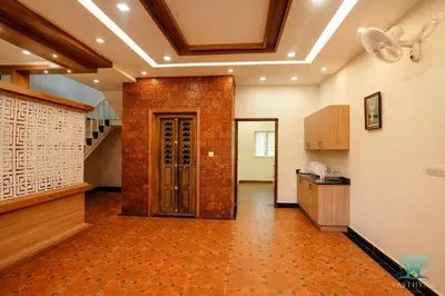 an empty room with a hallway with a door at Vasthyam in Kenichira
