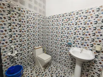 a bathroom with a toilet and a sink at Mannat Inn Homestay (Mysore) in Mysore