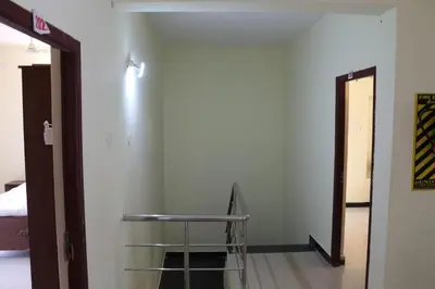 a room with a table and a room with a door at Shree SaiRenu near maruthamalai and bharathiyar univ and on the way to Adiyogi Isha Yoga centre in Marudhamalai