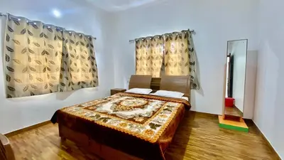 a bedroom with a bed in a room at La Flora kodaikanal in Kodaikānāl