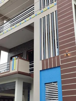 a facade of a house with a blue door at 