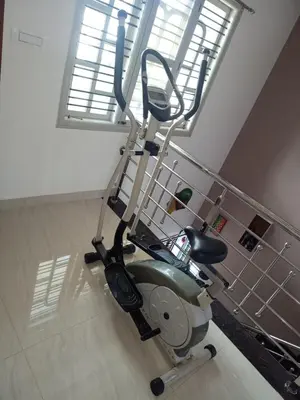 a treadmill in a room with a window at 