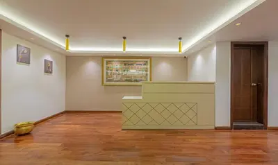an empty room with a counter in a museum at Treebo Windsor Heights, 8 Mins To Ketti Valley View Point in Ooty