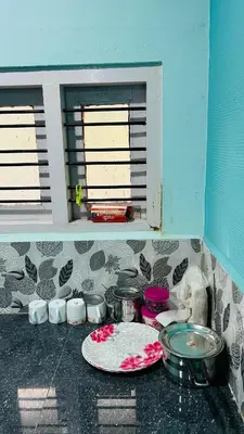a kitchen counter with a plate and some windows at Namasthe Inn AC, Ottapalam-Palakkad Highway, Lakkidi in Ottappālam