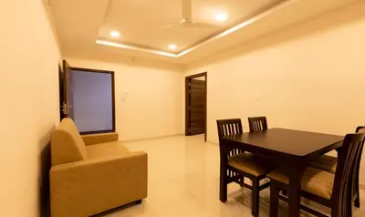 a dining room with a table and a chair at The Bee Hives , Nectar Nest in Coimbatore