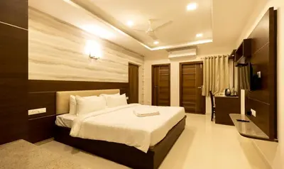 a bedroom with a large bed in a room at The Bee Hives , Nectar Nest in Coimbatore