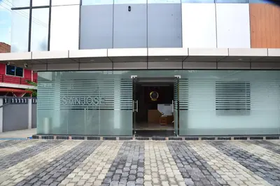 a building with the entrance to a building at Sanjose Residency in Virajpet