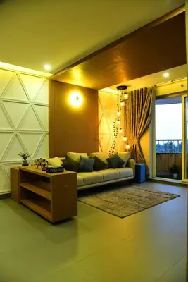 a living room with a couch and a table at Ivory sea castle in Kozhikode