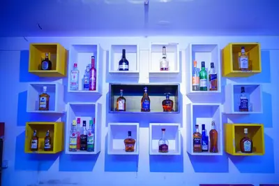 a toy display of liquor bottles on a wall at Zip by Spree Hotels Mangala International in Coimbatore