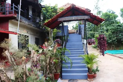 a stairway leading up to a house with plants at Coorg Northbreeze Estate stay in Madikeri