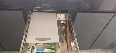 a drawer in a room with some scissors and a box at SHI's Peaceful Oasis near Isha Adiyogi, Kovai Kuttralam Waterfalls & Karunya University in Alāndurai