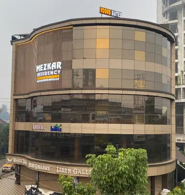 a large building with a sign on top of it at Mezkar Residency in Alwaye