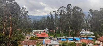 a view of a town with houses and trees at Nama-Stay - An escape villa in Ooty