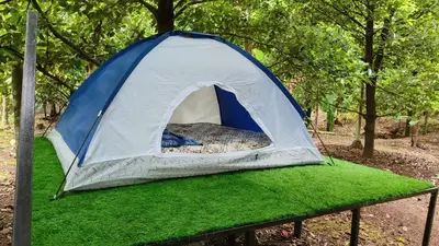 a blue and white tent on a patch of grass at Dragster Tents in Kizhake Chālakudi