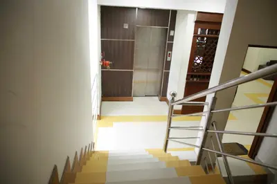 a view of a stairway with a shower in a building at Le Celestium in Munnar