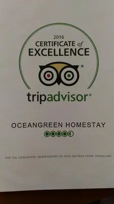 a sign with the wordsgraduate of excellence triadagency at Ocean Green Kerala in Kannur
