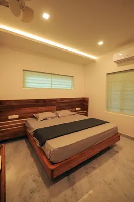 a bedroom with a large bed in a room at Redstone Villa in Tāzhekkod