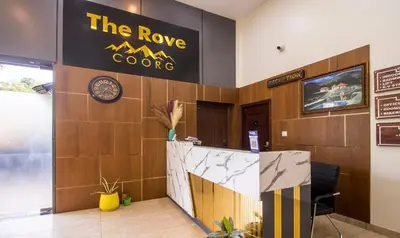 a lobby of a hotel with a sign for the rave coop at Treebo The Rove with Swimming Pool in Madikeri