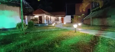 a yard at night with lights in the grass at JK Nature Stay Resorts in Kanthalloor