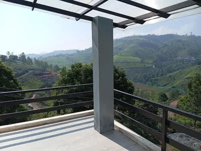 a balcony with a view of a valley at Sandy Castle Villa 3 Bhk Homestay in Ooty