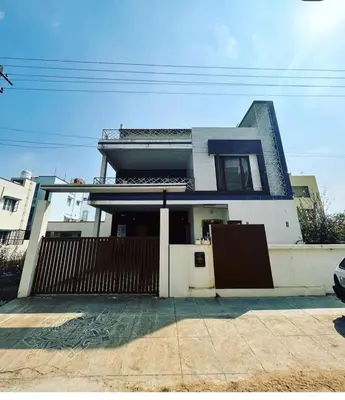 a house with a gate in front of it at Tranquil Haven Villa Homestay in Mysore