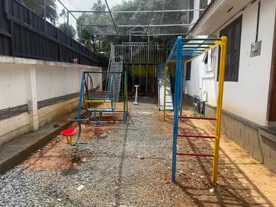 a group of playground equipment in a building at Empire Pool Villa in Meenangadi