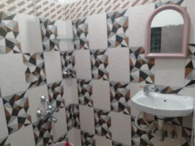 a bathroom with a sink and a mirror at Misty Moonrise in Kūkkāl