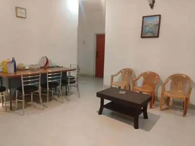 a dining room with a table and chairs at Misty Moonrise in Kūkkāl