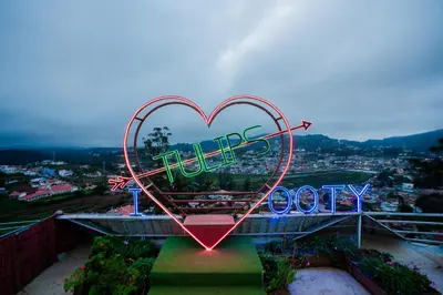 a sign in the shape of a heart on a building at Tulips Resorts - Elkhill in Ooty