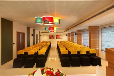 a conference room with yellow and black chairs in it at PARK RESIDENCY ARCADIA in Alwaye