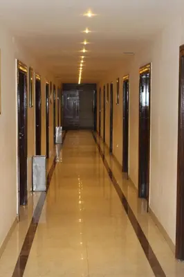 a hallway of a building with a long corridor at Grand Milestone in Mysore