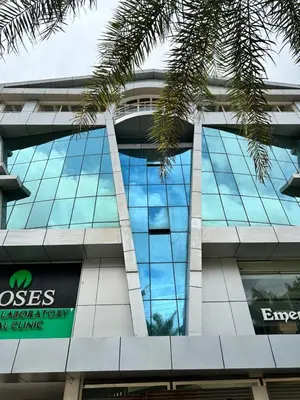 an office building with blue glass windows on it at Nakshatra Emerald in Guruvāyūr